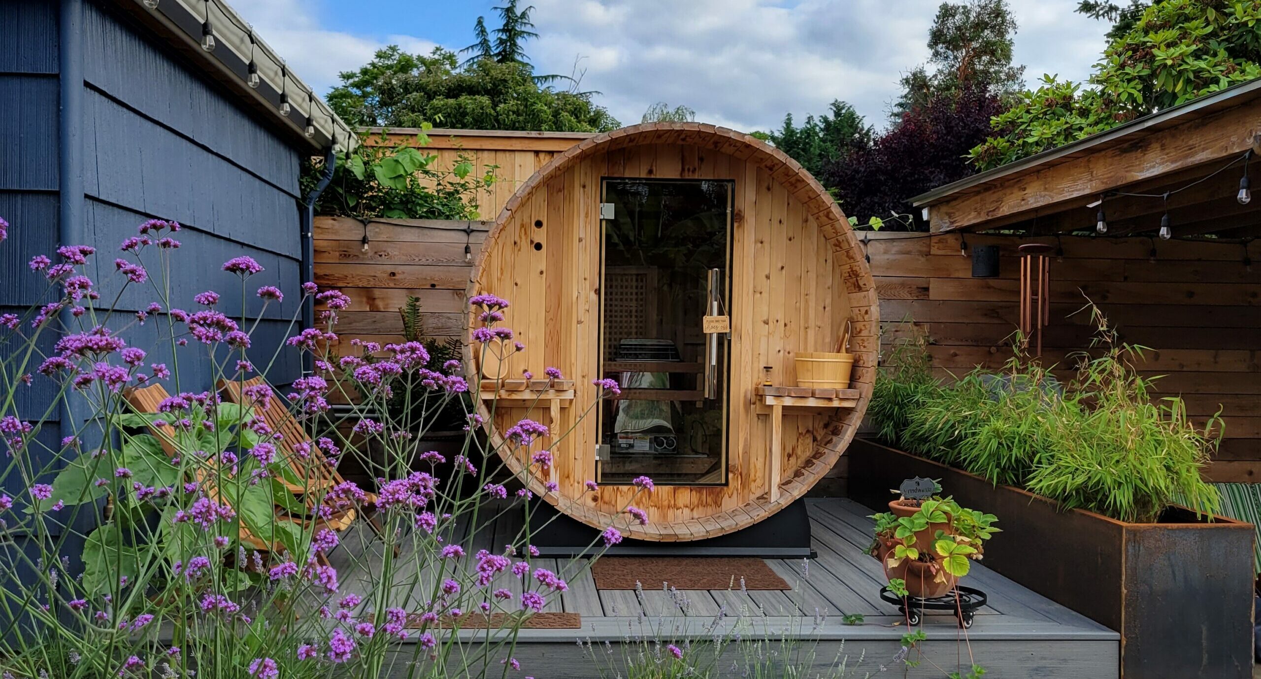 Outdoor barrel sauna in a beautiful backyard setting